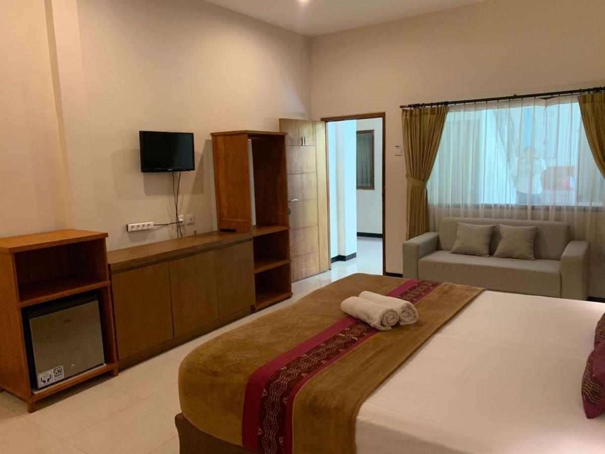 Kuta Suci Guesthouse ภายนอก รูปภาพ