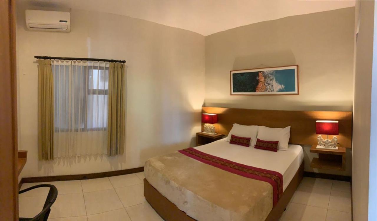 Kuta Suci Guesthouse ภายนอก รูปภาพ