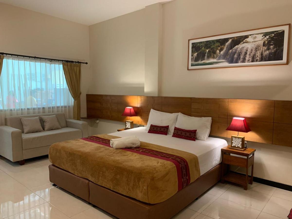 Kuta Suci Guesthouse ภายนอก รูปภาพ