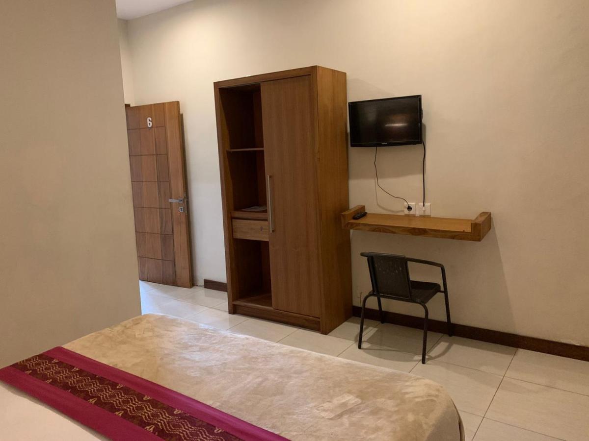 Kuta Suci Guesthouse ภายนอก รูปภาพ