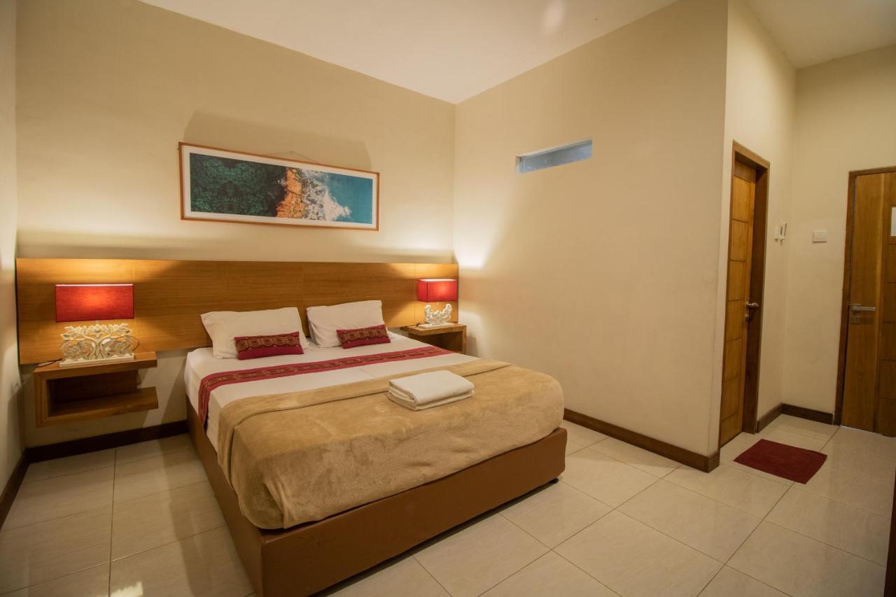 Kuta Suci Guesthouse ภายนอก รูปภาพ