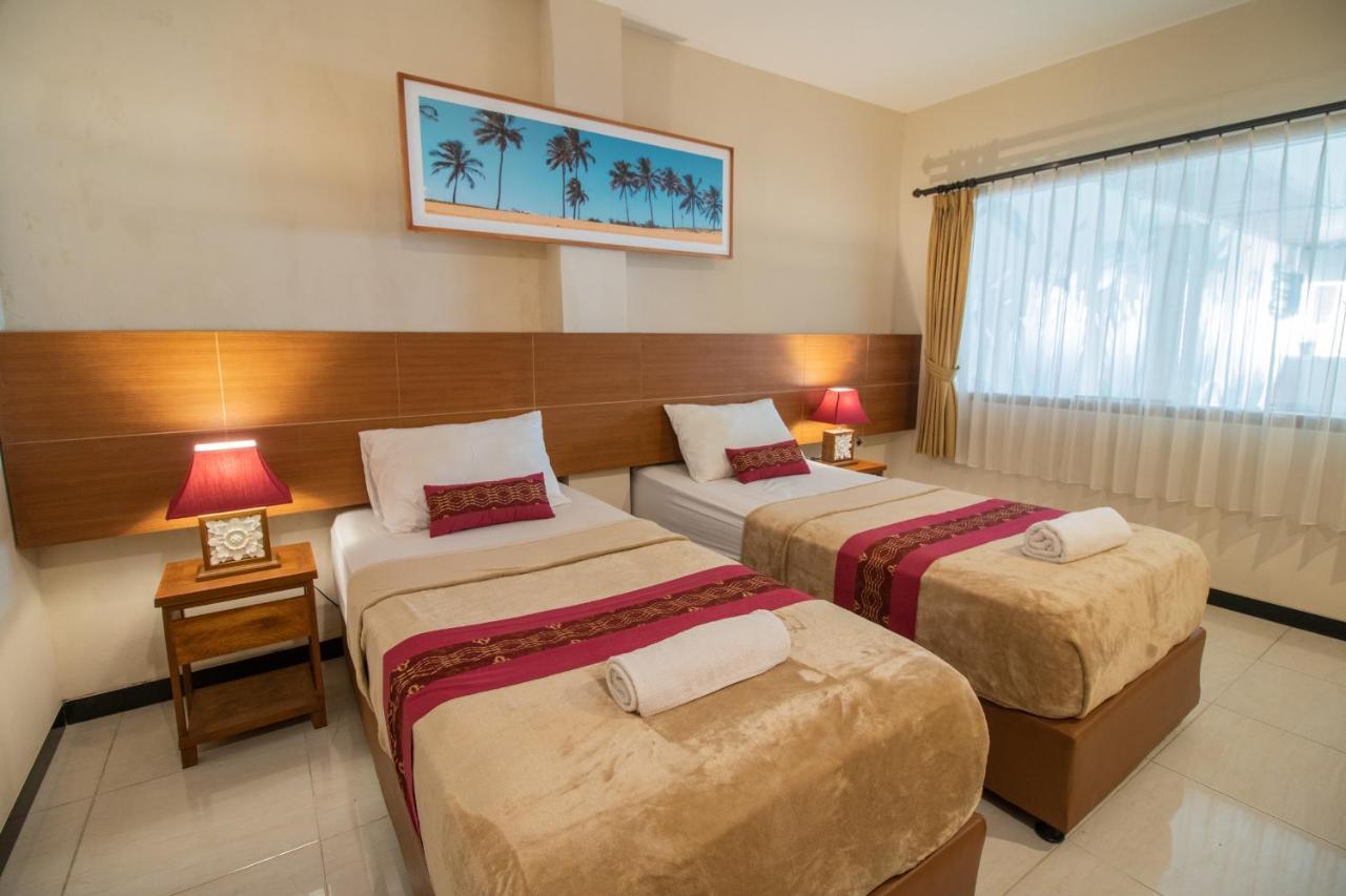 Kuta Suci Guesthouse ภายนอก รูปภาพ