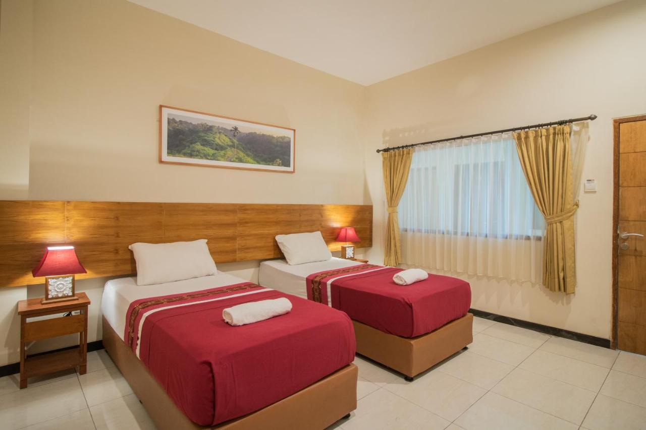 Kuta Suci Guesthouse ภายนอก รูปภาพ
