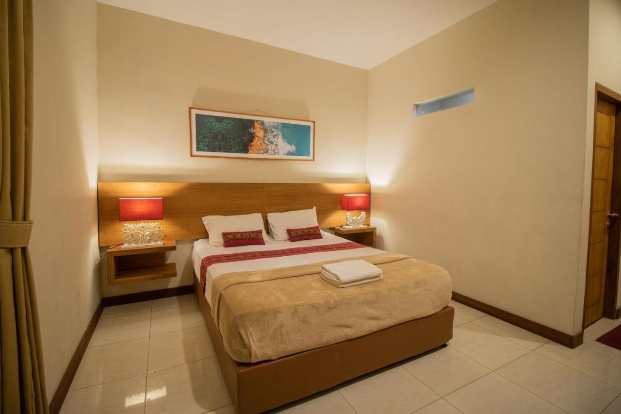 Kuta Suci Guesthouse ภายนอก รูปภาพ