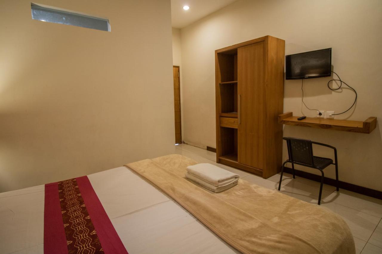 Kuta Suci Guesthouse ภายนอก รูปภาพ