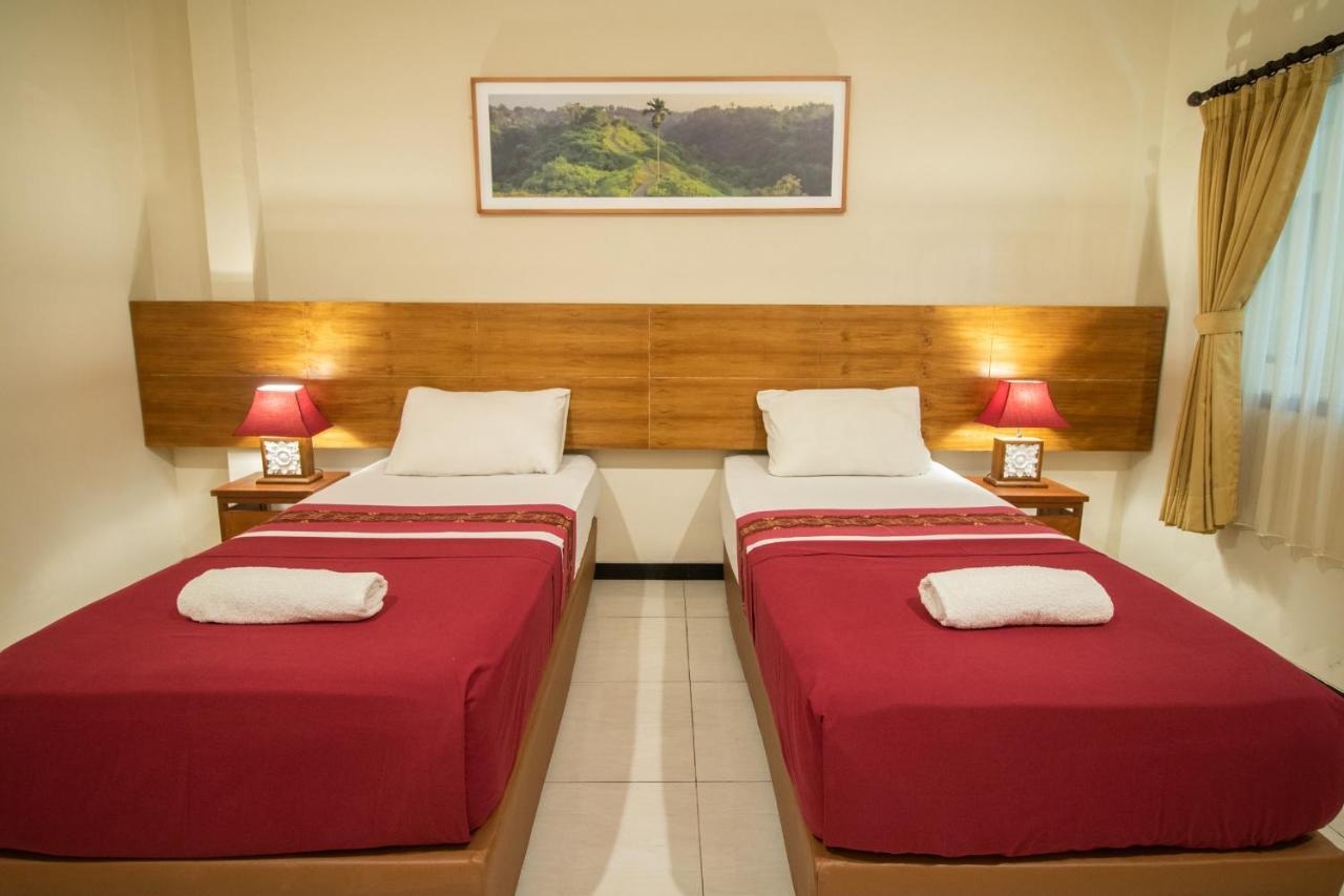 Kuta Suci Guesthouse ภายนอก รูปภาพ