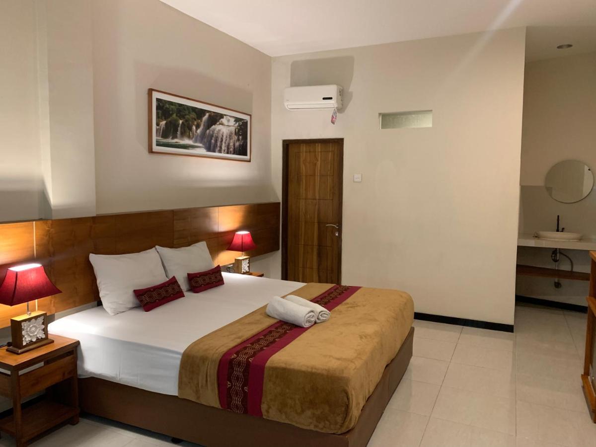 Kuta Suci Guesthouse ภายนอก รูปภาพ