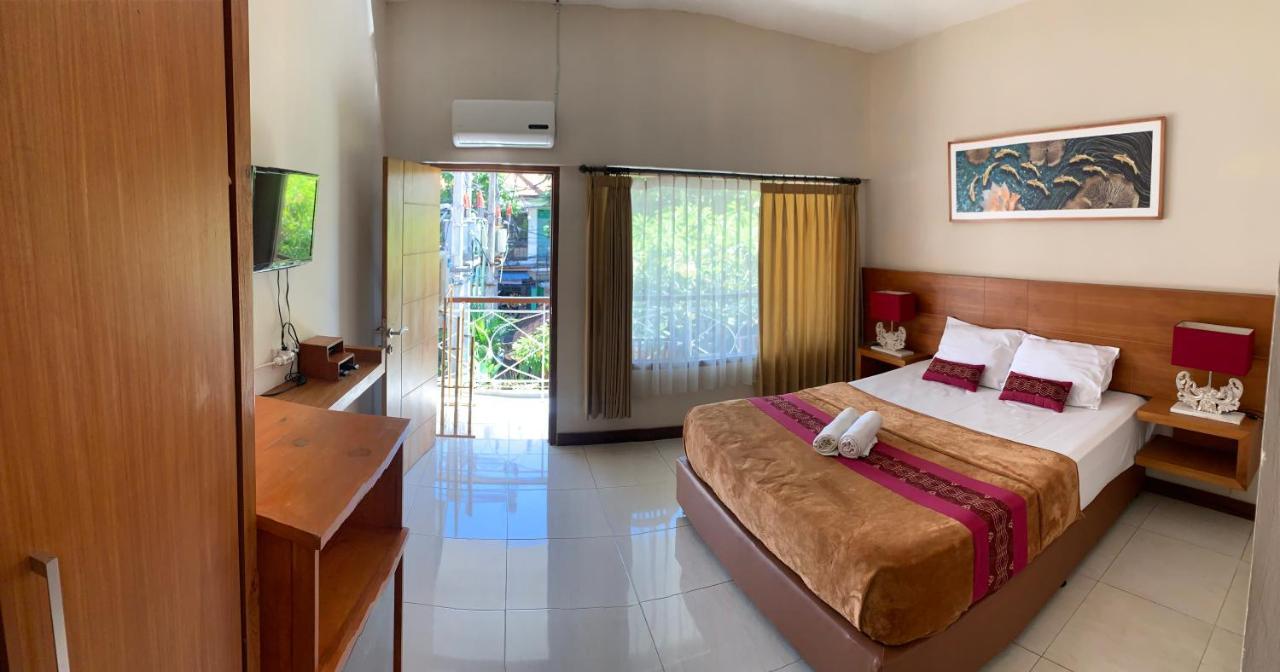 Kuta Suci Guesthouse ภายนอก รูปภาพ