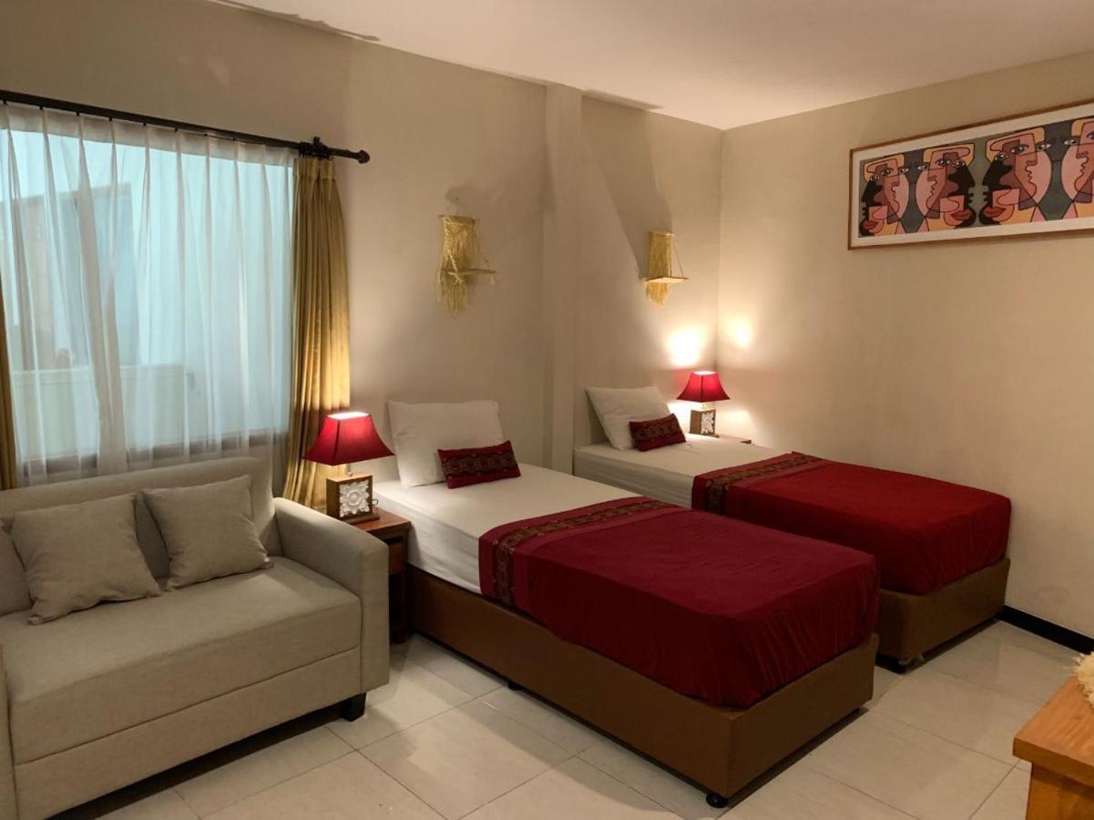 Kuta Suci Guesthouse ภายนอก รูปภาพ