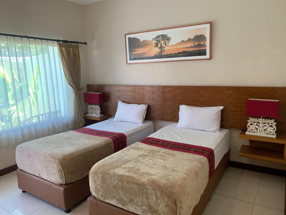 Kuta Suci Guesthouse ภายนอก รูปภาพ
