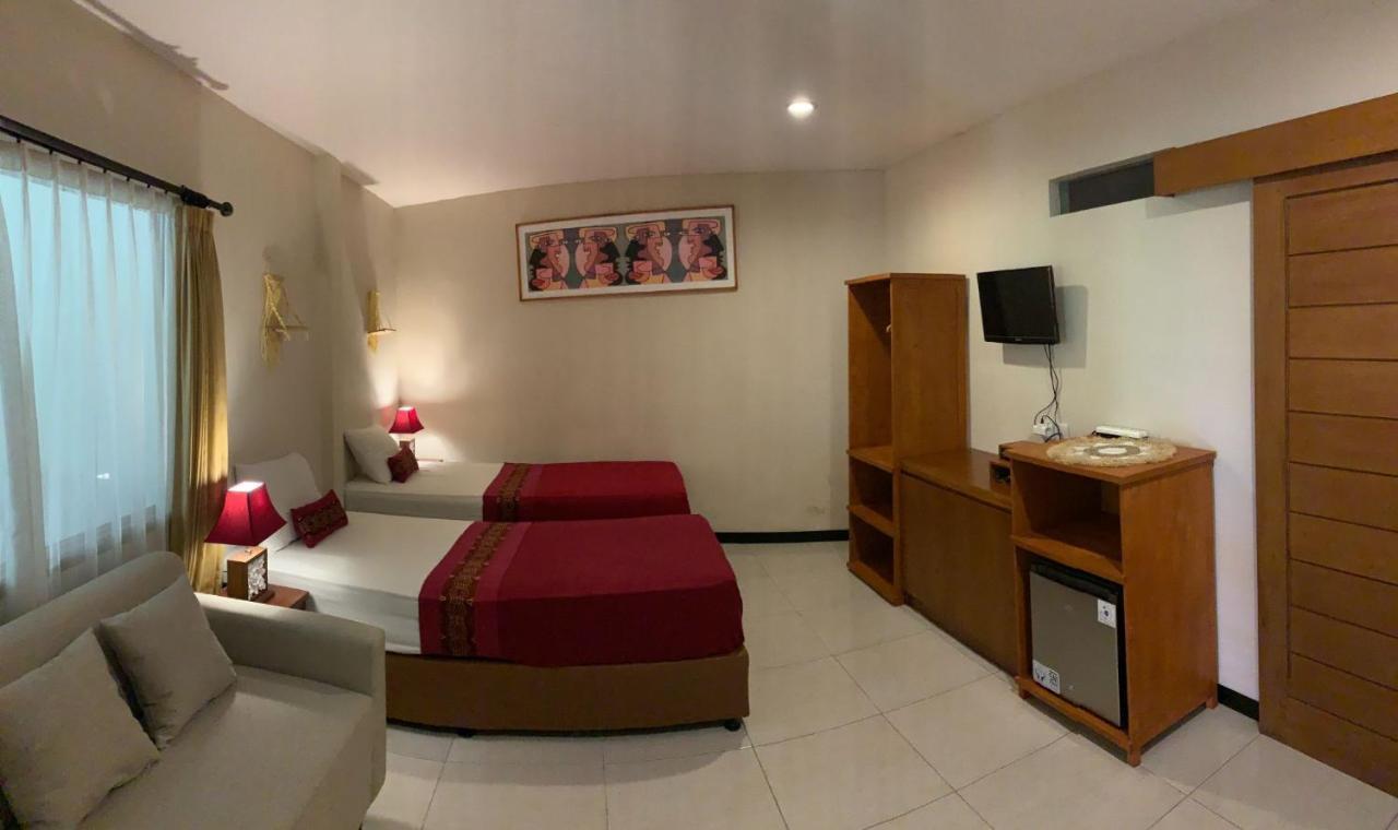 Kuta Suci Guesthouse ภายนอก รูปภาพ