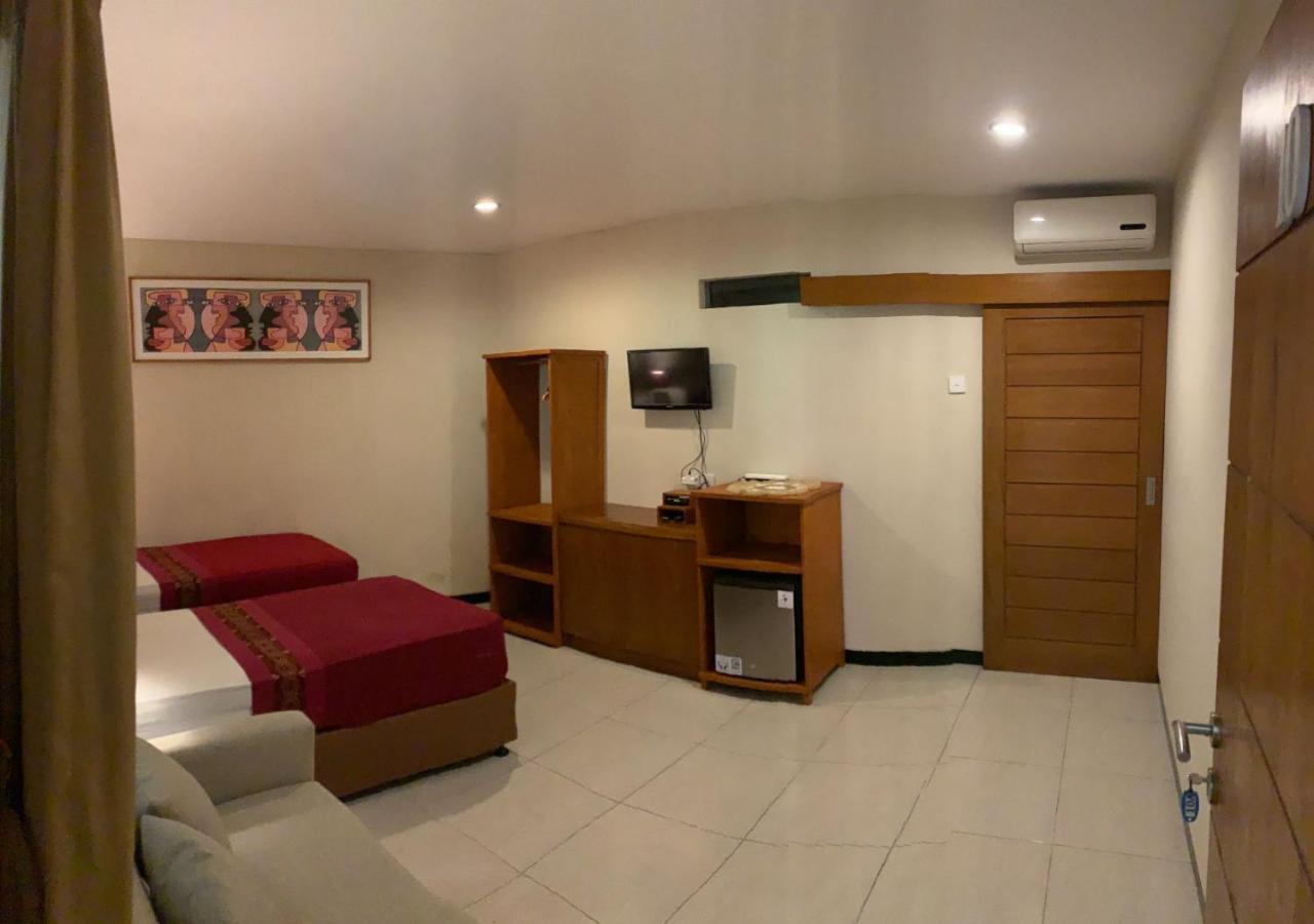 Kuta Suci Guesthouse ภายนอก รูปภาพ