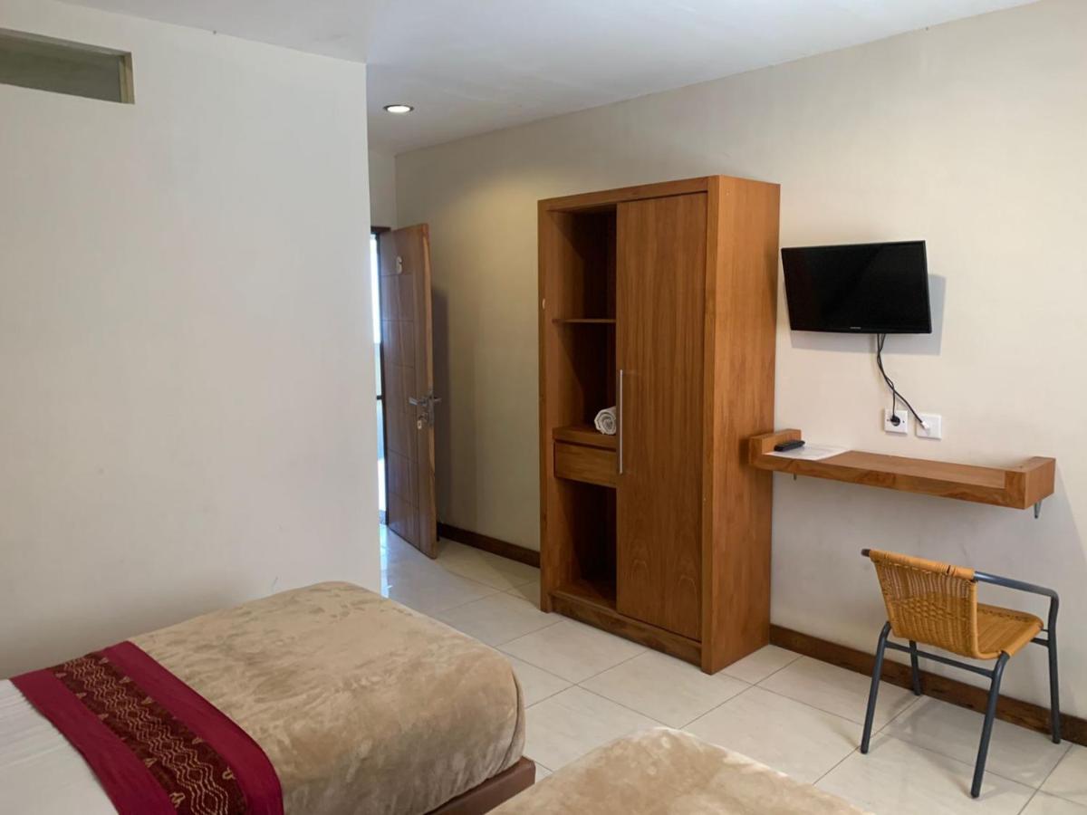 Kuta Suci Guesthouse ภายนอก รูปภาพ