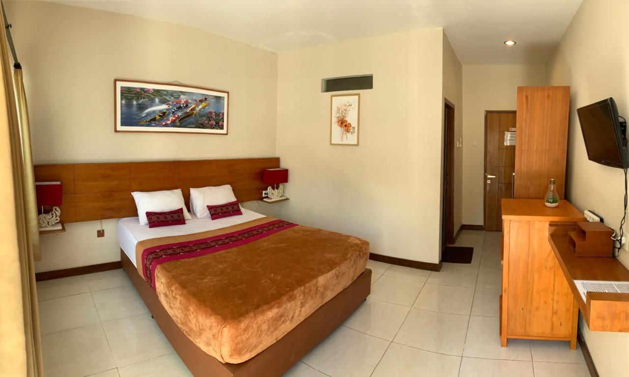 Kuta Suci Guesthouse ภายนอก รูปภาพ