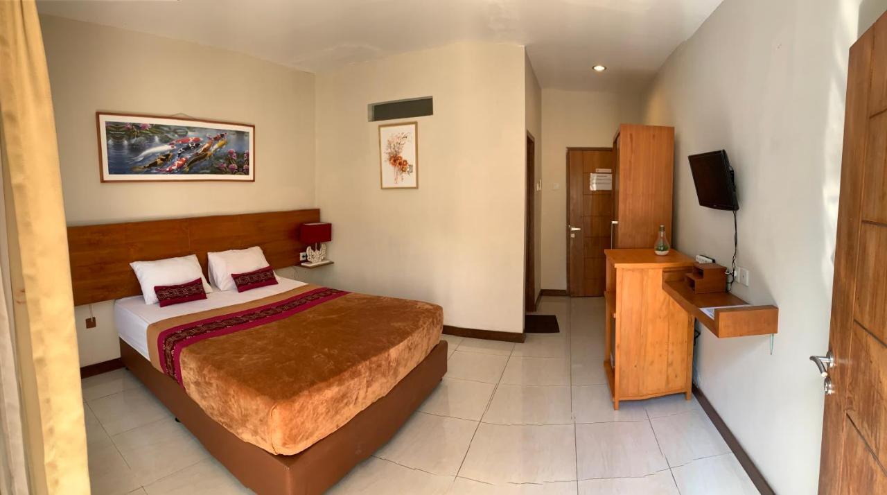 Kuta Suci Guesthouse ภายนอก รูปภาพ