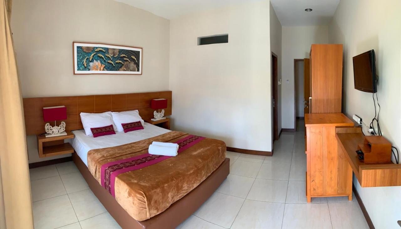 Kuta Suci Guesthouse ภายนอก รูปภาพ