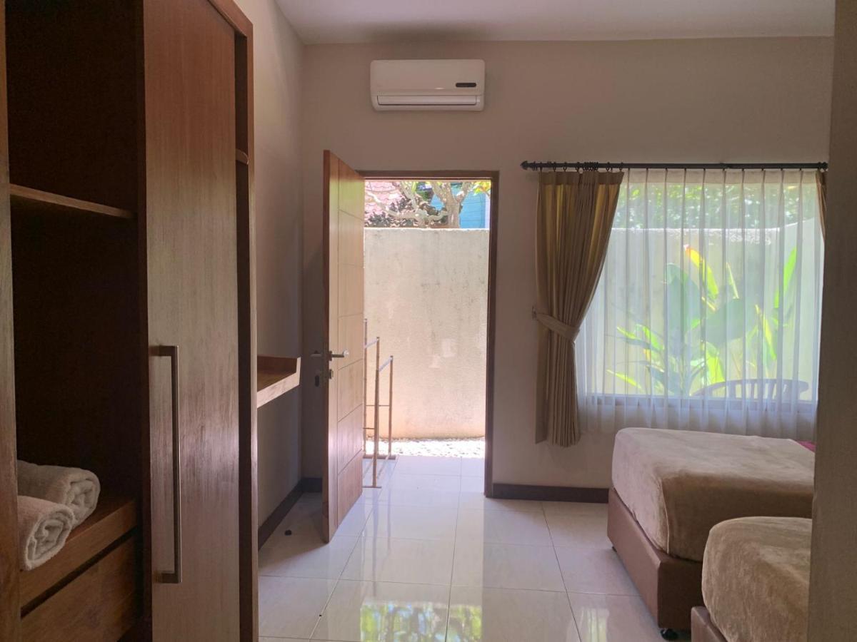 Kuta Suci Guesthouse ภายนอก รูปภาพ