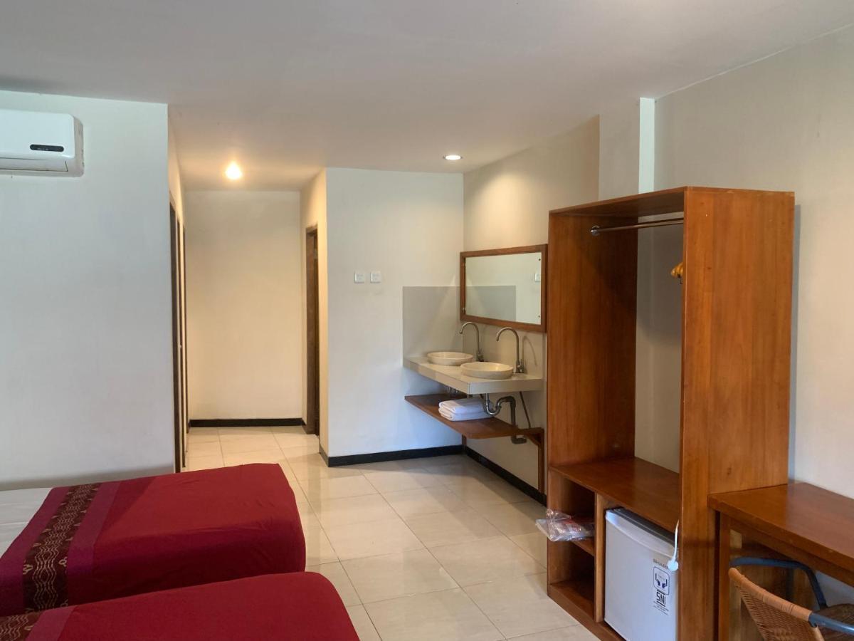 Kuta Suci Guesthouse ภายนอก รูปภาพ